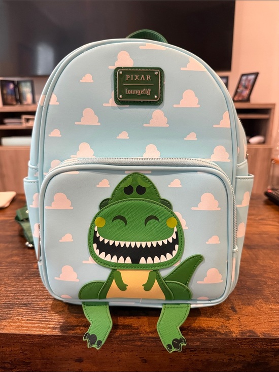 Loungefly Handbags - Loungefly Light Blue Pixar Rex Backpack
